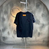 Close-up detail shot of Louis Vuitton cotton t-shirt with runway-inspired design