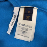Side profile of Louis Vuitton luxury clothing with signature branding