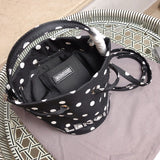 Top view of polished elevated women's handbag – women's luxury accessory