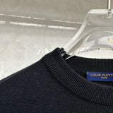 Close-up detail shot of Louis Vuitton luxury clothing with contemporary cut