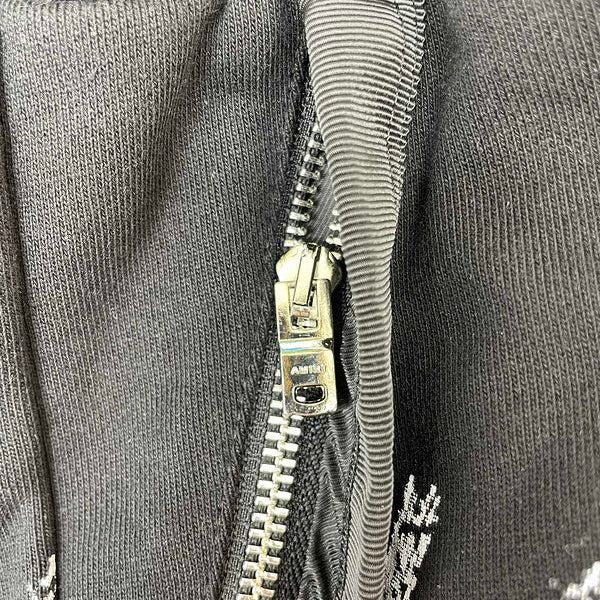 Three-quarter angle view of Amiri luxury piece style No.076