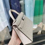  Elegant top-handle bag carried on shoulder 10