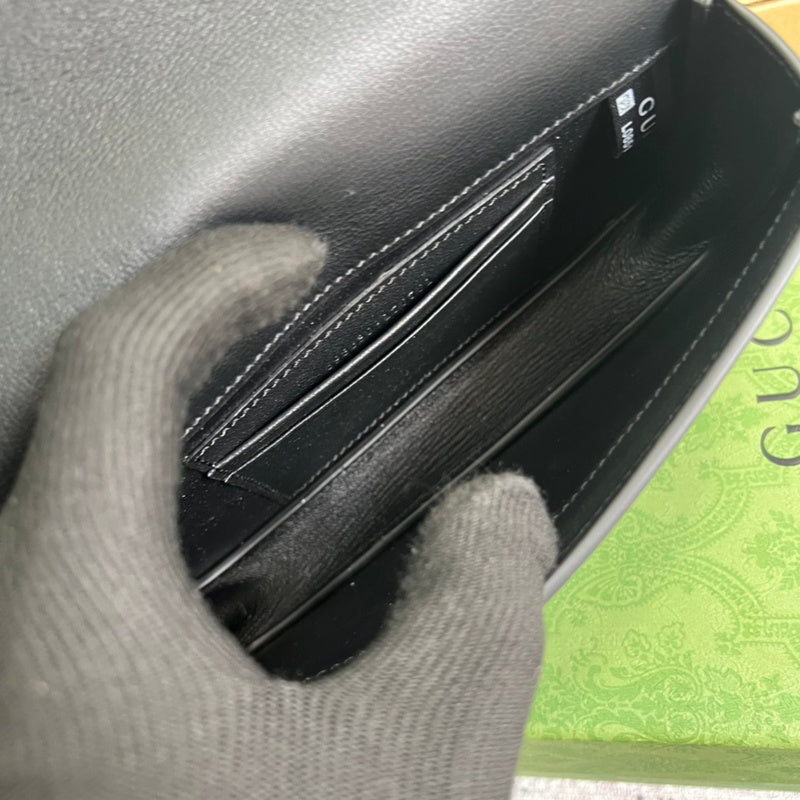 Close-up detail of sleek polished women's handbag – women's statement bag