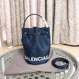Side profile of statement sleek women's handbag – women's statement bag