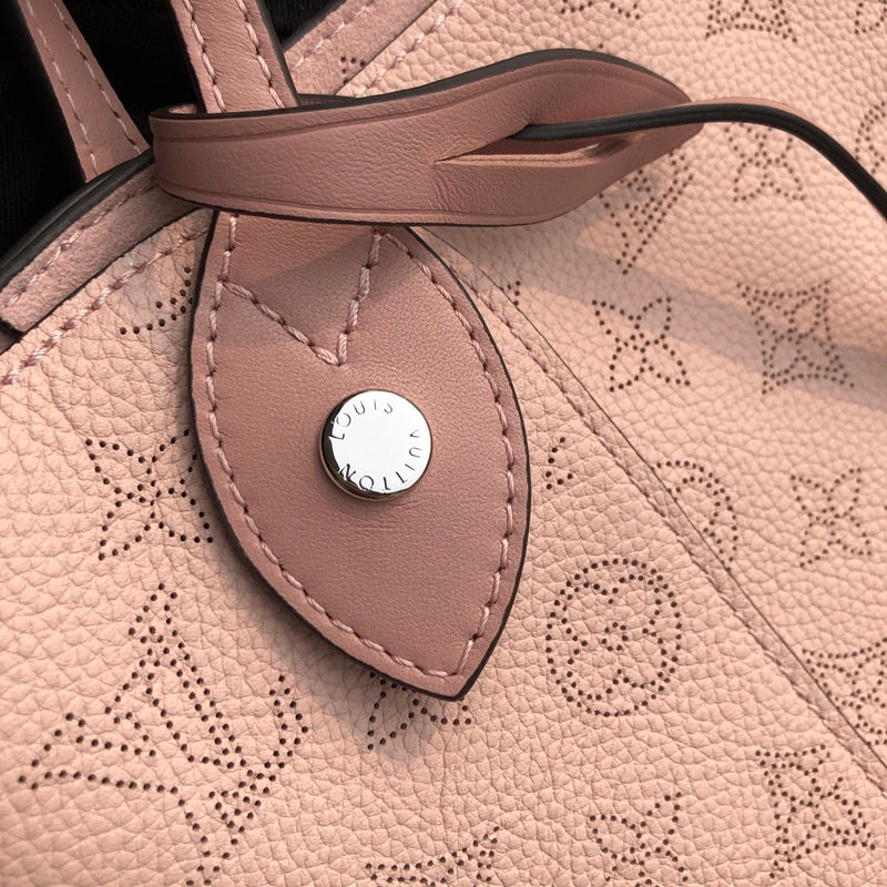 Side profile of elevated signature women's handbag – women's statement bag
