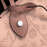 Side profile of elevated signature women's handbag – women's statement bag