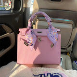 Side view of classic structured handbag