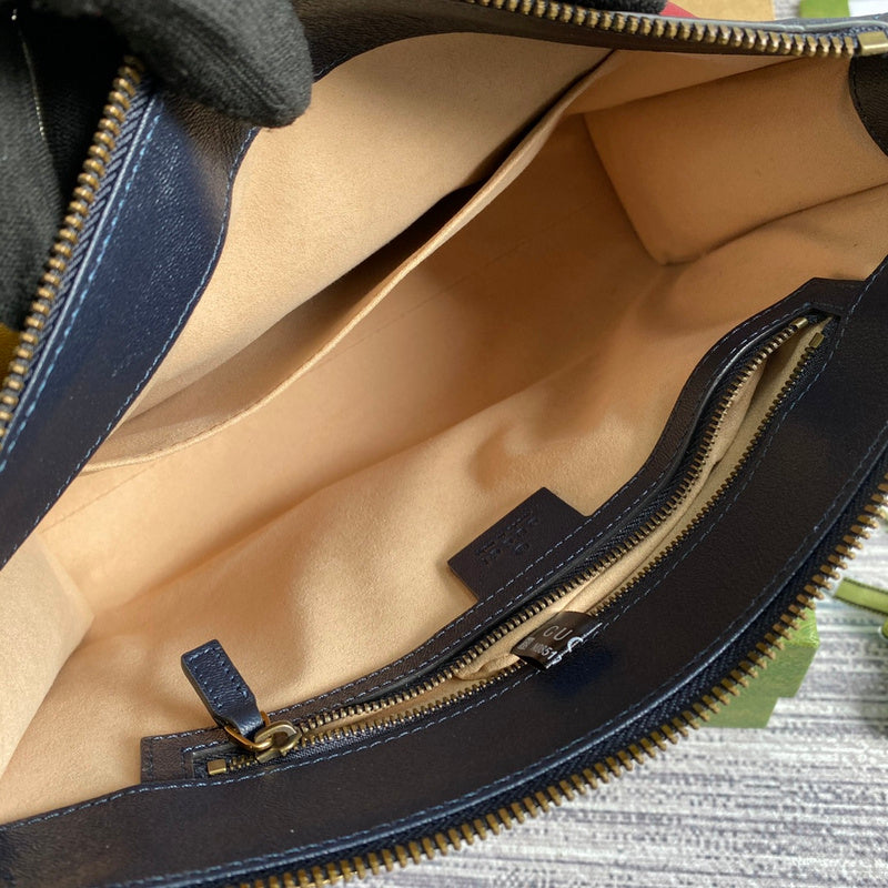 Side profile of sleek refined women's handbag – women's statement bag