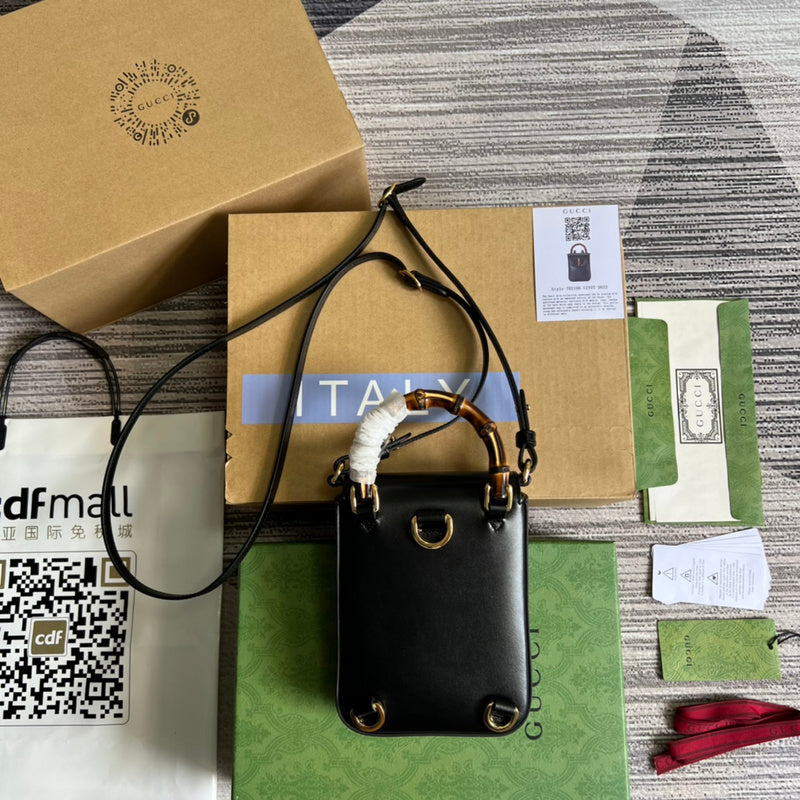 Styled lifestyle shot of sleek signature women's handbag – women's luxury accessory