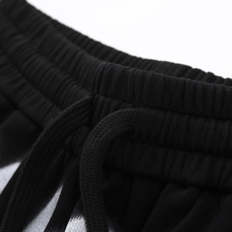 Flat lay presentation of Gucci luxury clothing with monogram-inspired silhouette