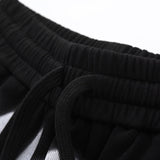Flat lay presentation of Gucci luxury clothing with monogram-inspired silhouette