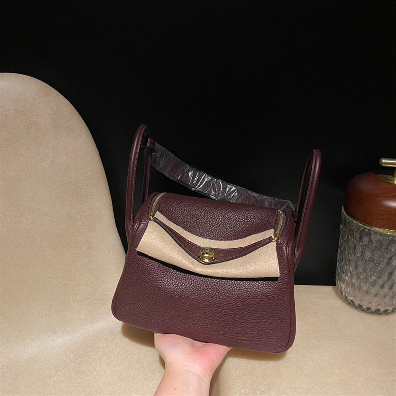 Side view of tailored structured handbag