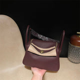 Side view of tailored structured handbag