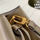Handle and strap detail of classic statement women's handbag – women's everyday handbag