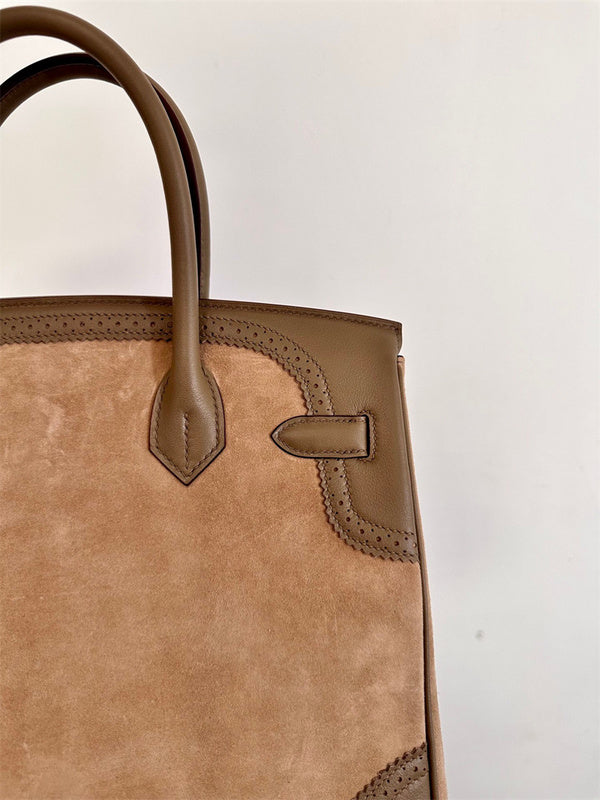  Contemporary top-handle bag carried on shoulder
