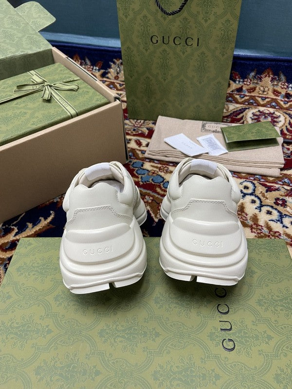 Side profile of Gucci neutral cream sneakers streetwear statement look