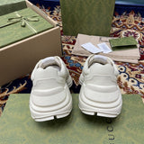 Side profile of Gucci neutral cream sneakers streetwear statement look