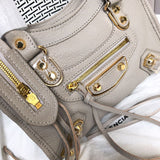 Styled lifestyle shot of polished classic women's handbag – women's luxury accessory