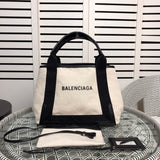 Side profile of modern everyday-luxe women's handbag – women's statement bag