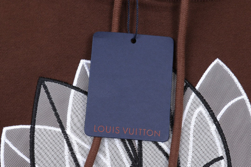 Close-up detail shot of Louis Vuitton luxury clothing with runway-inspired design