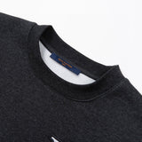 Close-up detail shot of Louis Vuitton luxury clothing with signature branding