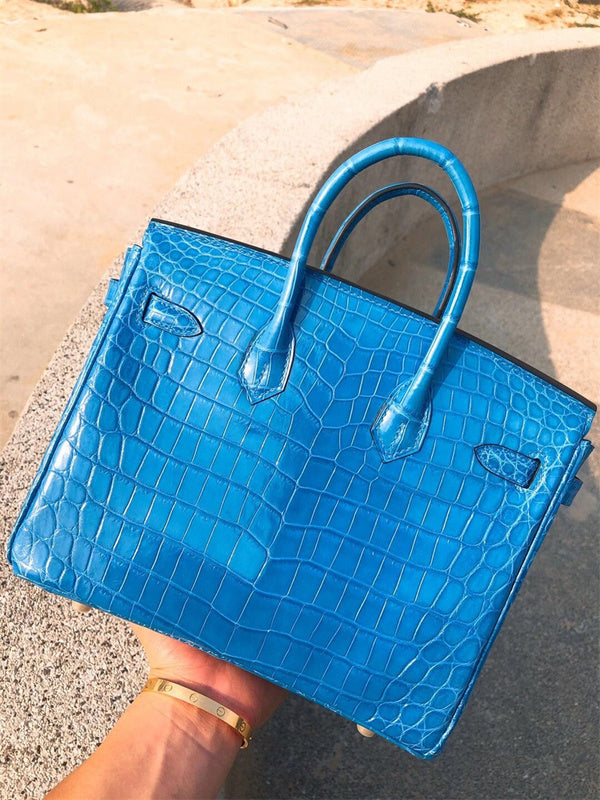 refined top-handle bag styled with outfit