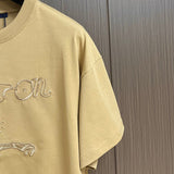 Full styled look of Louis Vuitton cotton t-shirt with label-forward styling