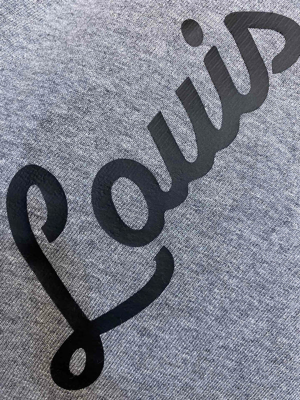 Close-up detail shot of Louis Vuitton cotton t-shirt with signature branding
