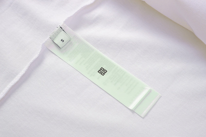 Close-up detail shot of Givenchy luxury clothing with signature branding