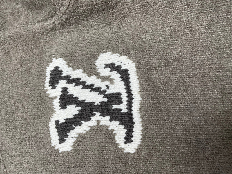 Front view of Louis Vuitton luxury clothing with label-forward styling