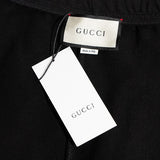 Side profile of Gucci luxury clothing with tailored silhouette