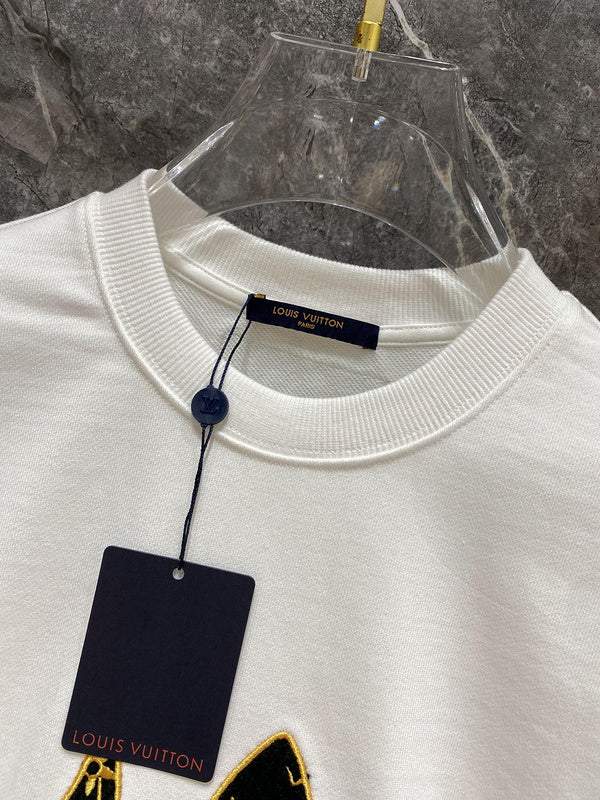 Side profile of Louis Vuitton luxury clothing with label-forward styling
