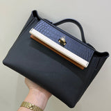 Side view of minimalist structured handbag