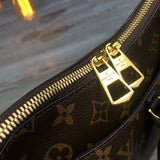 Top view of classic sleek women's handbag – women's statement bag