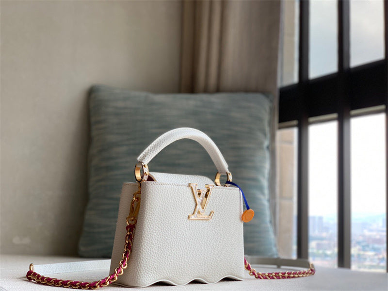  Sophisticated top-handle bag carried on shoulder