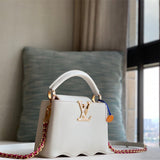  Sophisticated top-handle bag carried on shoulder