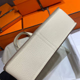 Side view of understated structured handbag