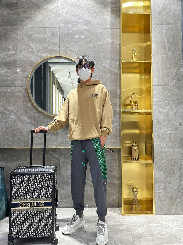 Flat lay presentation of Louis Vuitton luxury clothing with everyday silhouette