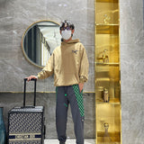Flat lay presentation of Louis Vuitton luxury clothing with everyday silhouette