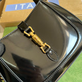 Back view of polished sleek women's handbag – women's luxury accessory