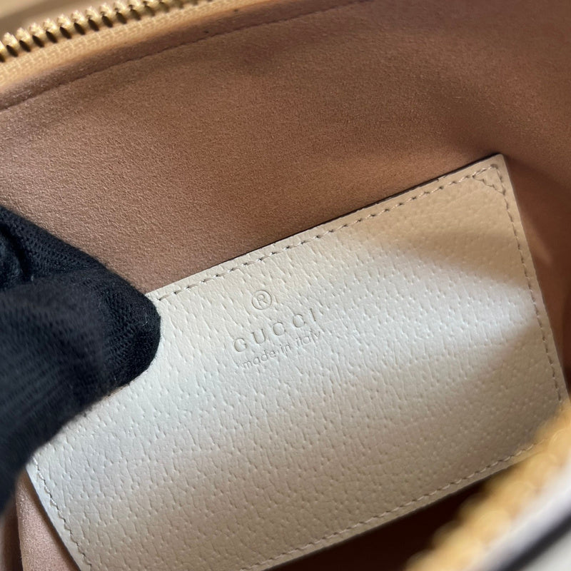 Side view of versatile structured handbag