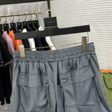 Back view of Rhude luxury clothing with monogram-inspired silhouette