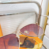 Close-up detail view of Louis Vuitton unisex sunglasses