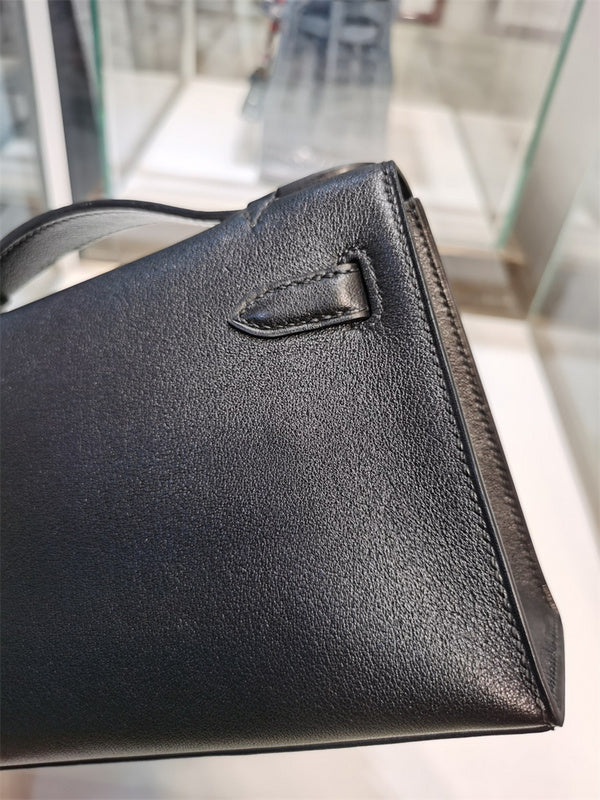 Side view of poised structured handbag
