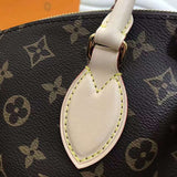 Handle and strap detail of chic polished women's handbag – women's everyday handbag