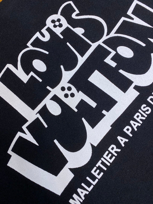 Close-up detail shot of Louis Vuitton cotton t-shirt with signature branding