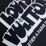 Close-up detail shot of Louis Vuitton cotton t-shirt with signature branding