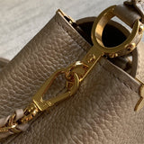  Sleek structured bag carried on shoulder 64