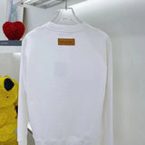 Back view of Louis Vuitton luxury clothing with runway-inspired design