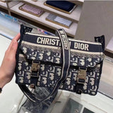 Handle and strap detail of structured signature women's handbag – women's designer-style accessory